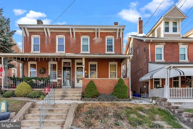 view of front of property featuring covered porch