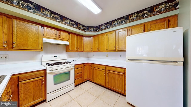 kitchen featuring white appliances and light tile patterned floors