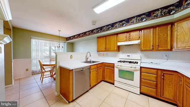 kitchen featuring sink, white gas range, stainless steel dishwasher, a chandelier, and pendant lighting