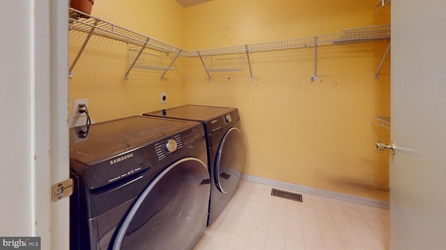 clothes washing area featuring washing machine and dryer