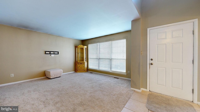 entryway with light carpet