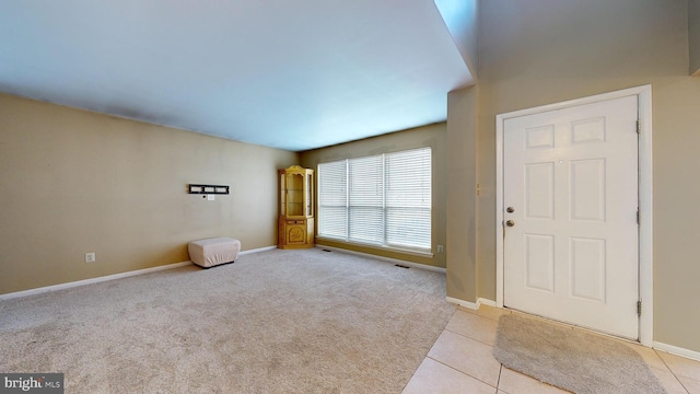 entrance foyer featuring light tile patterned floors