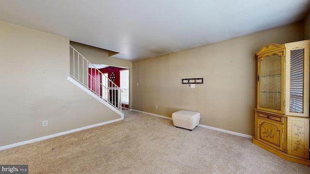 interior space featuring light colored carpet