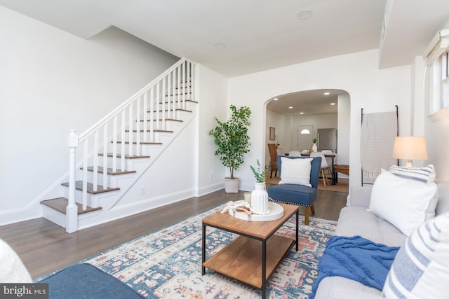 living room with dark hardwood / wood-style flooring