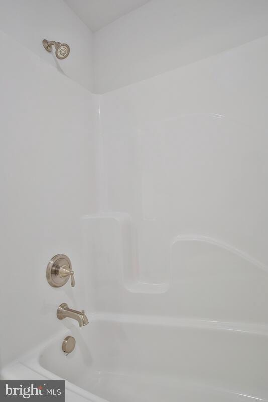 details featuring shower / bathing tub combination