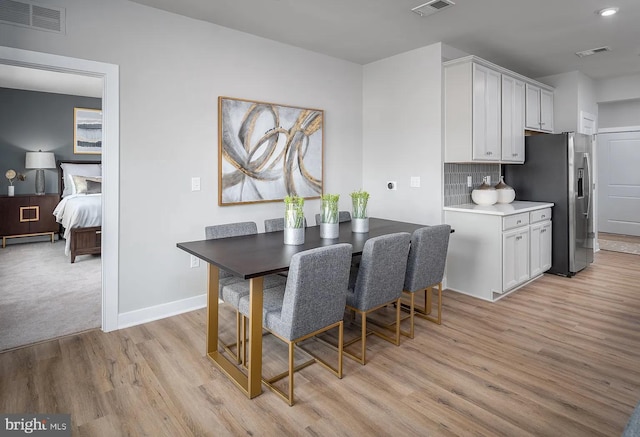 dining room featuring light hardwood / wood-style floors