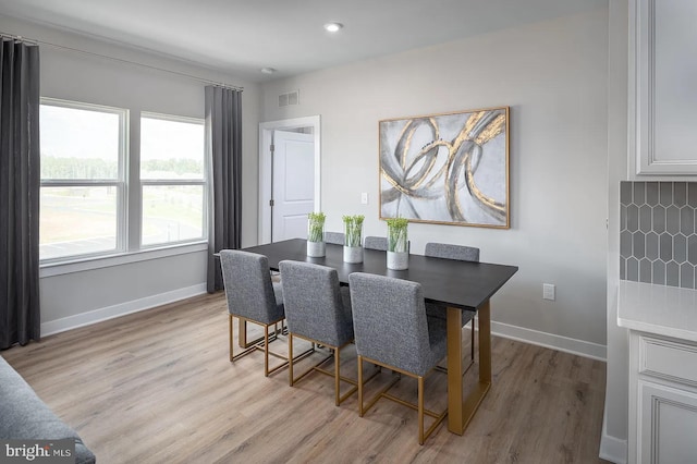 dining area with light wood-type flooring