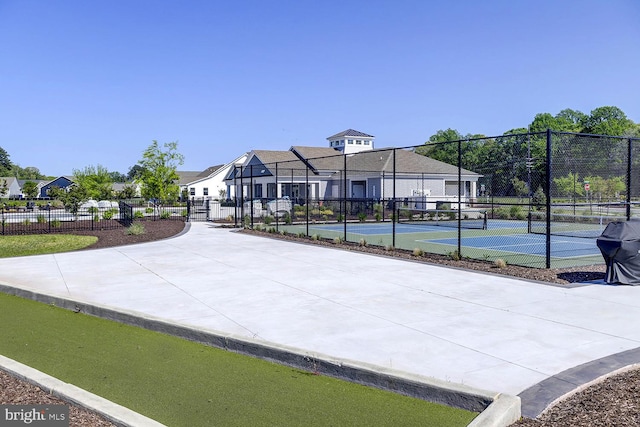 surrounding community with tennis court