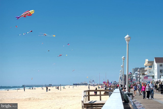 view of property's community with a view of the beach and a water view