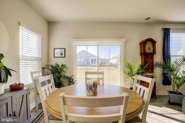 dining area featuring light hardwood / wood-style floors and a healthy amount of sunlight