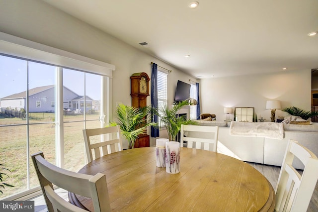 dining space with light hardwood / wood-style flooring