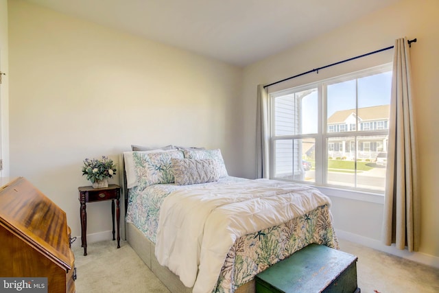 bedroom with light colored carpet