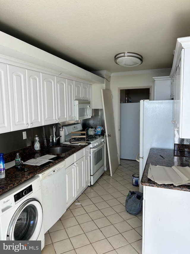 kitchen featuring white cabinets, white appliances, crown molding, and washer / clothes dryer