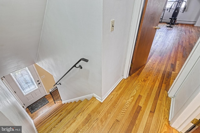 stairway featuring hardwood / wood-style flooring