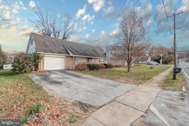 view of property exterior featuring a lawn and a garage