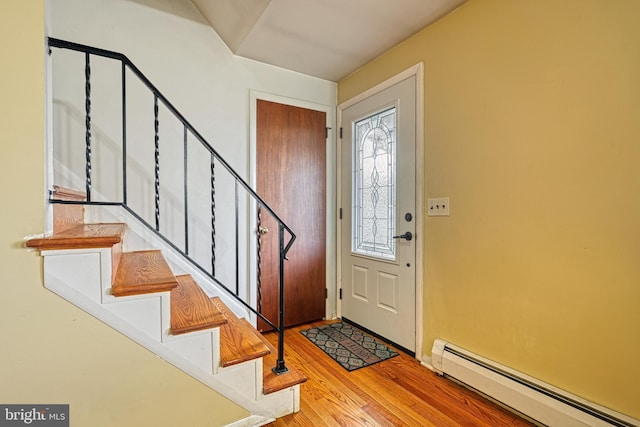 entryway featuring a baseboard radiator and light hardwood / wood-style floors