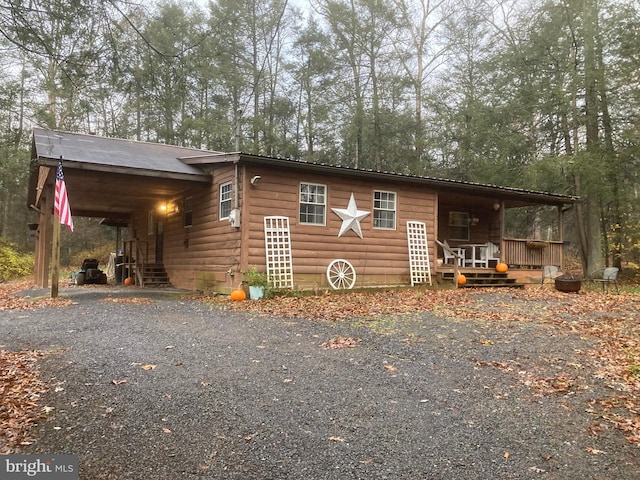 view of side of home with covered porch