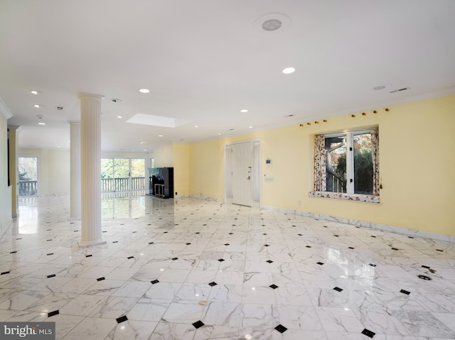 interior space featuring ornate columns and crown molding