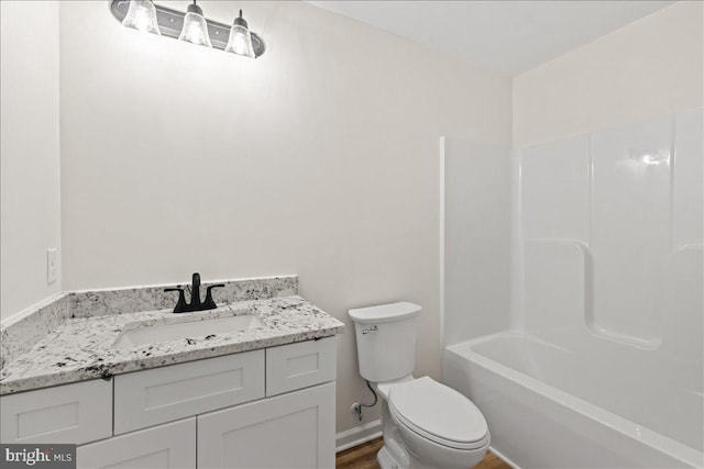 full bathroom featuring vanity, toilet, and tub / shower combination