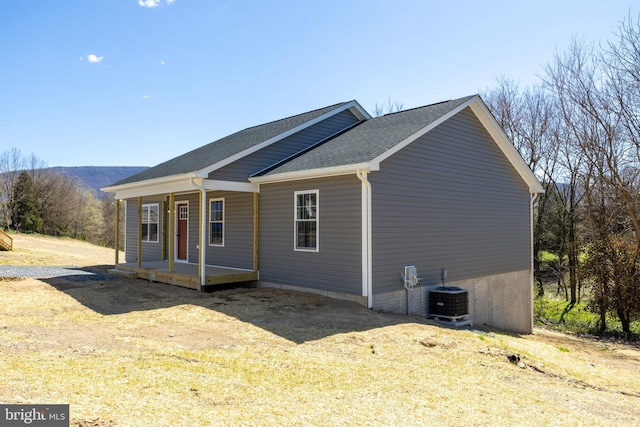 303 E Old Cross Rd, New Market, VA 22844 - view of side of home with a porch, cooling unit, and a shingled roof