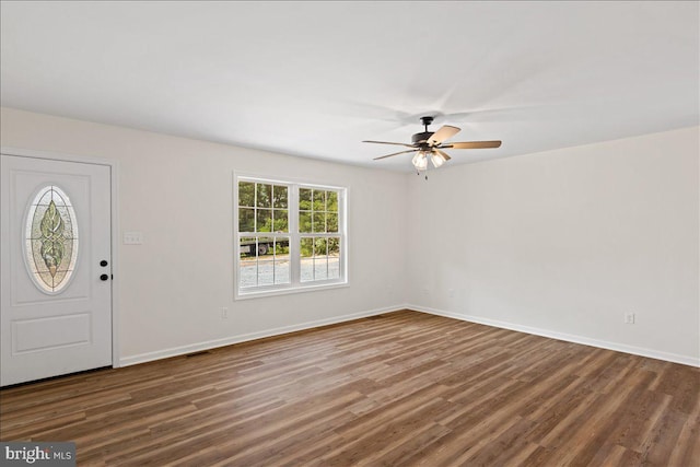 foyer entrance with dark hardwood / wood-style flooring and ceiling fan