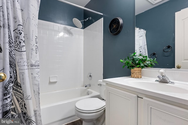 full bathroom featuring shower / bath combination with curtain, toilet, and vanity