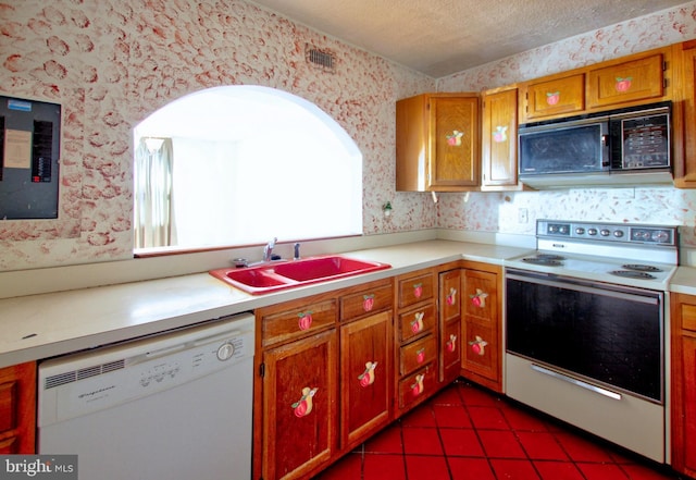 kitchen featuring white dishwasher, dark tile patterned flooring, sink, a textured ceiling, and electric range oven