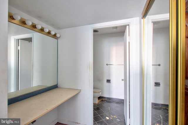 bathroom featuring tile patterned flooring and toilet