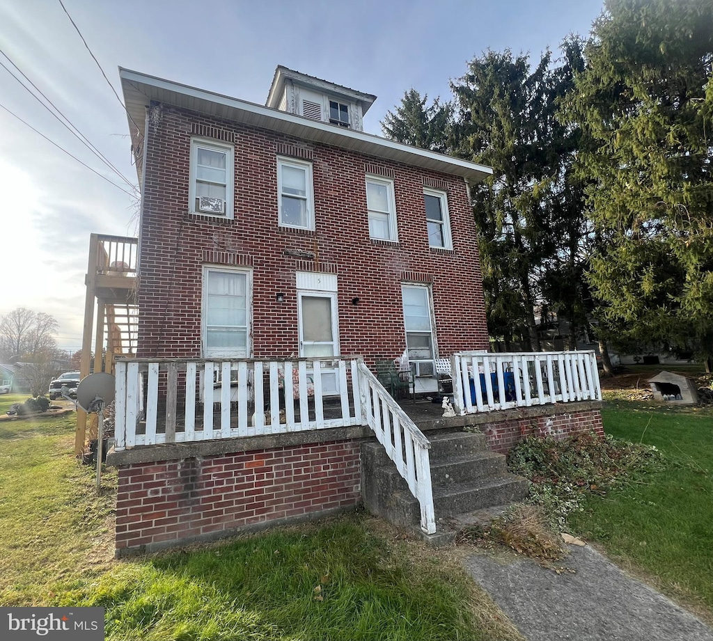 5 Brent St, Hancock, MD 21750 - view of front of house featuring brick siding and a front lawn