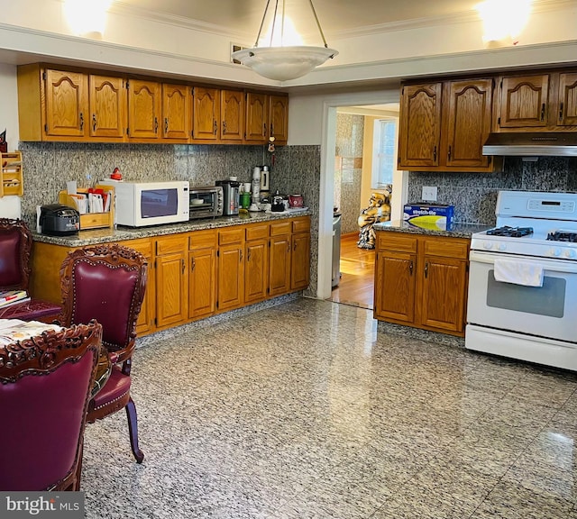 1503 Juniper Ave, Elkins Park, PA 19027 - kitchen featuring white appliances, under cabinet range hood, brown cabinetry, ornamental molding, and tasteful backsplash
