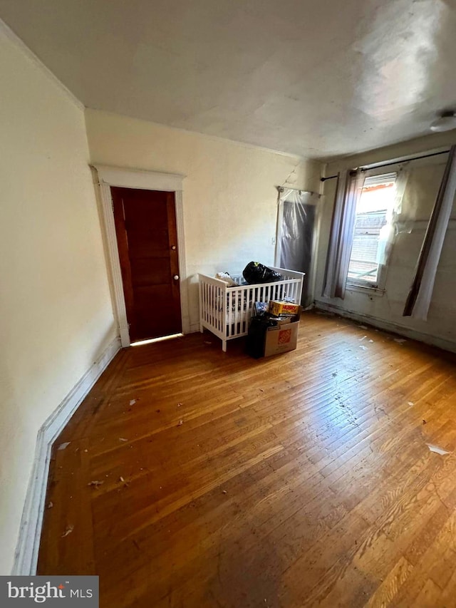 spare room with wood-type flooring