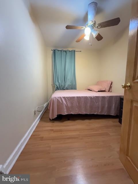 bedroom with ceiling fan and light wood-type flooring