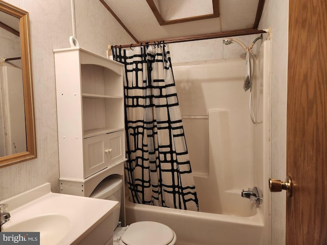 full bathroom featuring vanity, shower / bath combination with curtain, a textured ceiling, and toilet