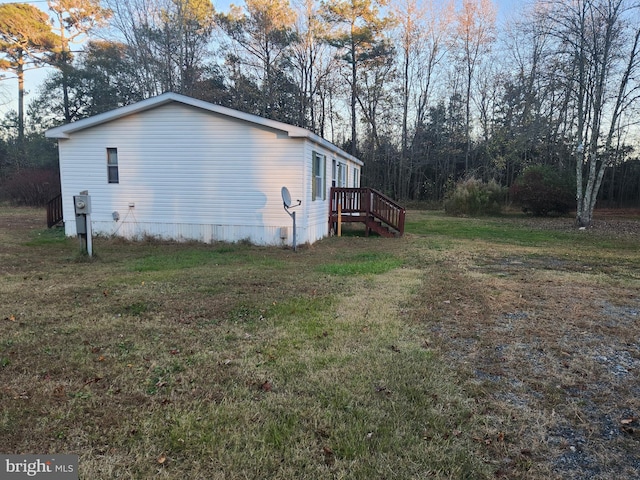 view of side of property featuring a yard