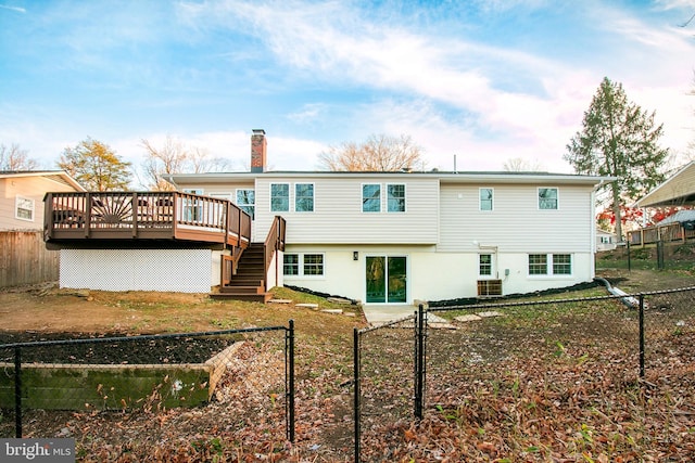 back of house with a wooden deck