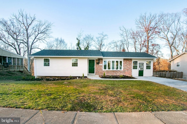 single story home with a front yard