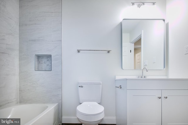 bathroom with vanity, toilet, and a bathing tub