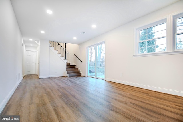 unfurnished living room featuring light hardwood / wood-style floors