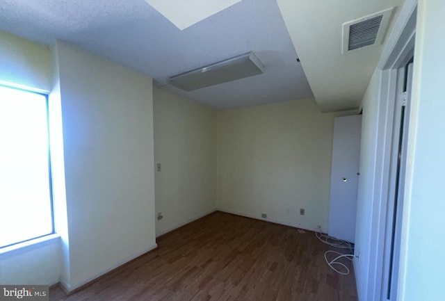 empty room featuring wood-type flooring