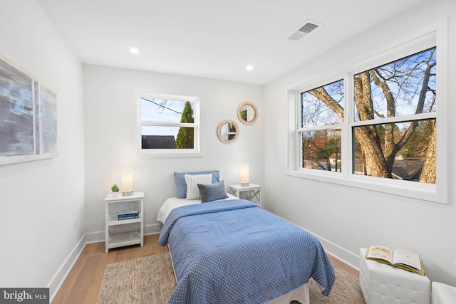 bedroom with light hardwood / wood-style flooring