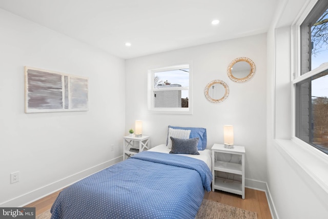 bedroom with hardwood / wood-style floors