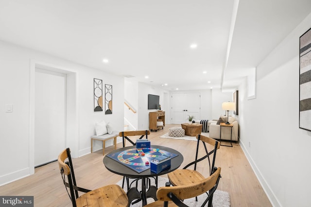 dining space featuring light wood-type flooring