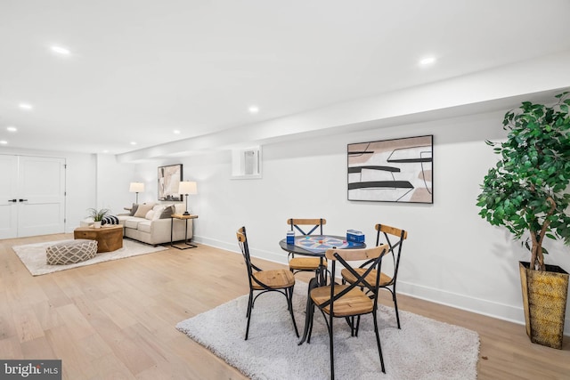 dining area with light hardwood / wood-style floors