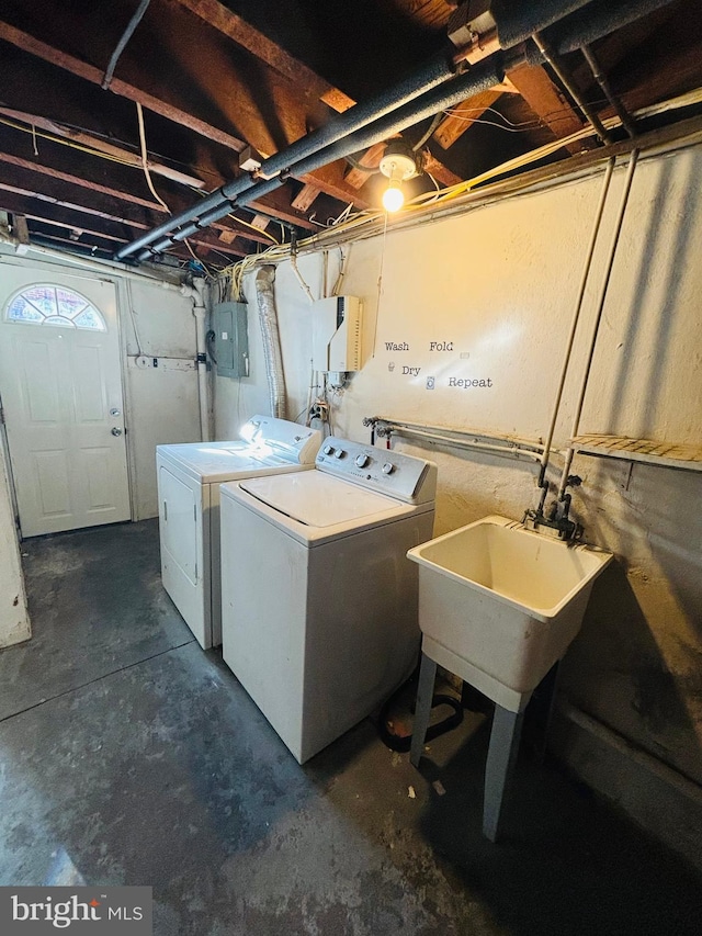 washroom featuring electric panel and washer and dryer