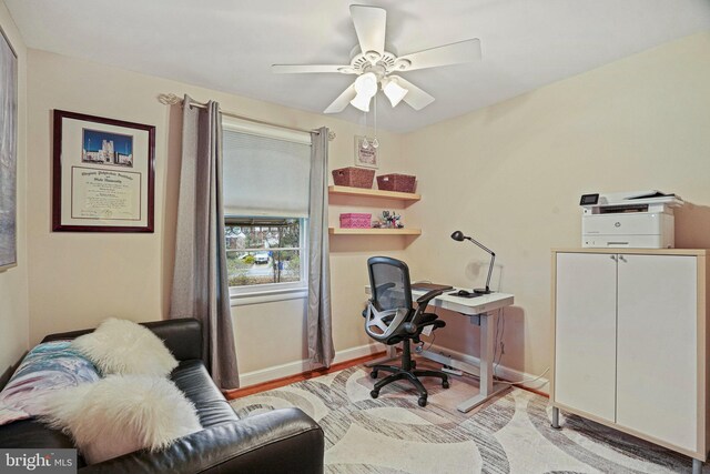 office space featuring ceiling fan and light wood-type flooring