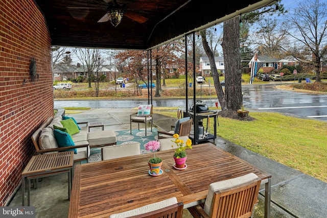 view of patio with outdoor lounge area and ceiling fan