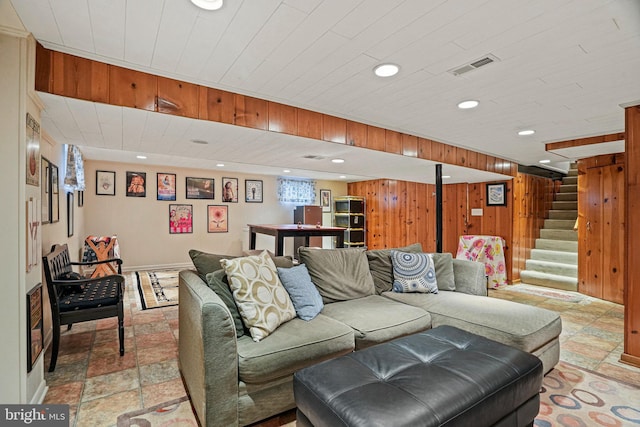 living room with wooden walls