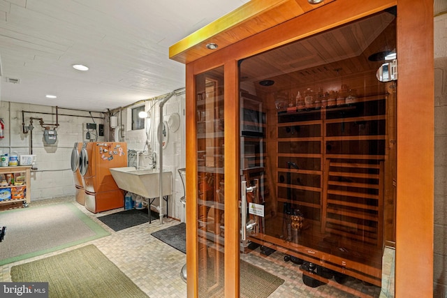 wine area featuring washer and dryer