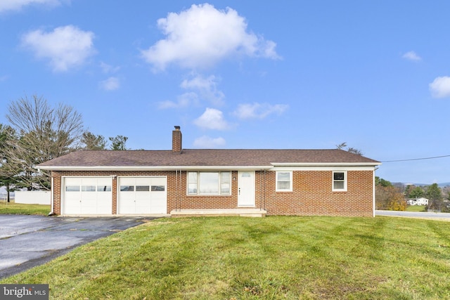 ranch-style home with a garage and a front yard