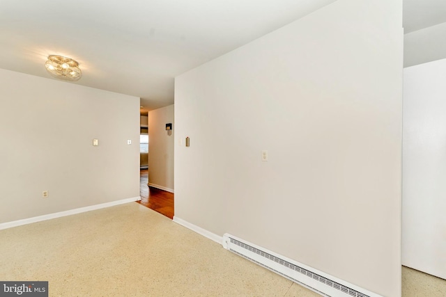 unfurnished room featuring a baseboard radiator